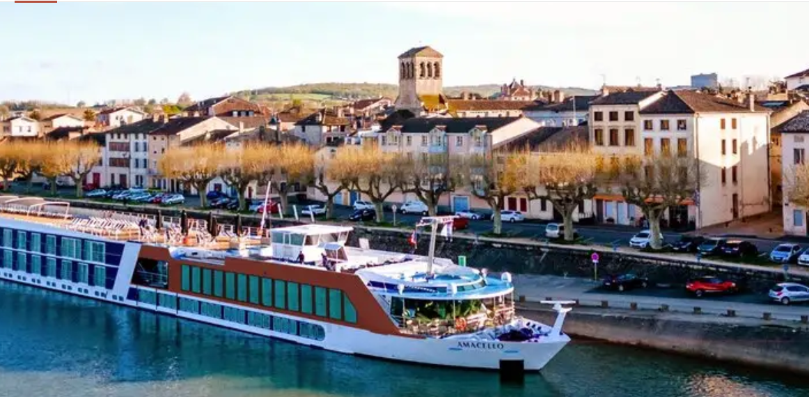 AmaCello docked beside a French riverside town